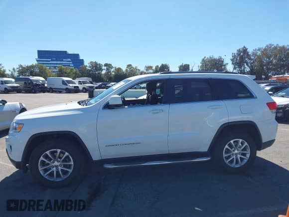 2015 Jeep Grand Cherokee Altitude z VIN 1C4RJFAG7FC122784, wystawiony jako IAAI lot #43438452 z przebiegiem 140 946 mil mil oraz . Historia ofert i sprzedaży dostępna na DreamBid. Obrazek 14.