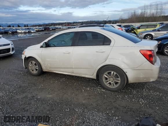 2012 Chevrolet Sonic LS with VIN 1G1JB5SH9C4174637, listed as a Copart auction lot 45942275 with 208,459 mi miles and Salvage title. Bid and sale history available at DreamBid. Image 2.