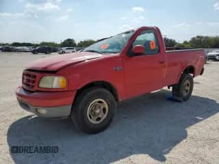 2003 Ford F-150 XL with VIN 1FTRF18223NA52111, listed as a Copart auction lot 74816344 with 175,021 mi miles and Salvage title. Bid and sale history available at DreamBid. Image 1.