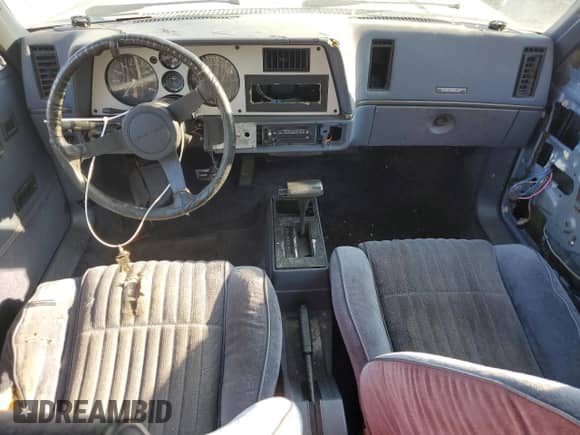 1984 Chevrolet Cavalier с VIN 1G1AD69P3EJ312352, выставлен на аукционе Copart как лот 81424985 с пробегом 517 098 миль миль и Списание • Salvage title. История ставок и продаж доступна на DreamBid. Изображение 8.