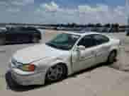 2002 Pontiac Grand Am GT z VIN 1G2NW52E62M603951, wystawiony jako Copart lot #65606355 z przebiegiem 76 254 mil mil oraz Szkoda całkowita • Salvage title. Historia ofert i sprzedaży dostępna na DreamBid. Obrazek 1.