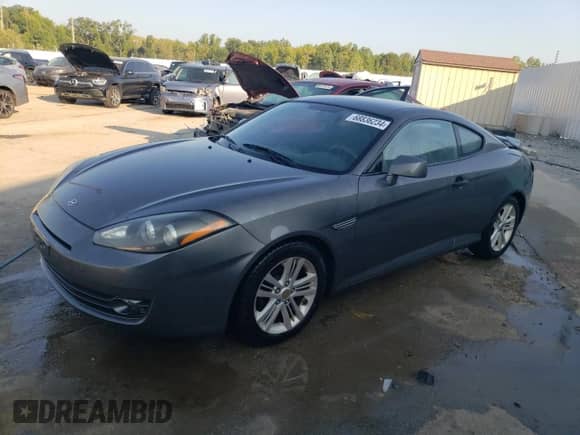 2007 Hyundai Tiburon GS с VIN KMHHM66D87U238729, выставлен на аукционе Copart как лот 68836234 с пробегом 185 898 миль миль и На запчасти • Non repairable. История ставок и продаж доступна на DreamBid. Изображение 1.