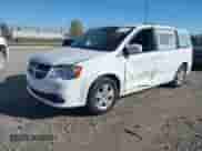 2019 Dodge Grand Caravan SXT with VIN 2C4RDGCG5KR774556, listed as a IAAI auction lot 43411147 with 164,795 mi miles and . Bid and sale history available at DreamBid. Image 2.