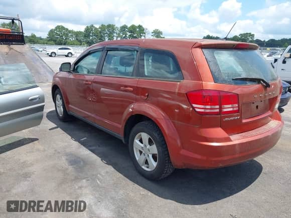 2013 Dodge Journey SE with VIN 3C4PDCAB6DT601569, listed as a IAAI auction lot 42816122 with 180,363 mi miles and . Bid and sale history available at DreamBid. Image 3.