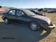 1996 Saturn SL with VIN 1G8ZK527XTZ335205, listed as a Copart auction lot 42230735 with 82,344 mi miles and Salvage title. Bid and sale history available at DreamBid. Image 4.