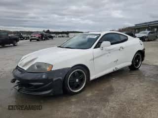 2003 Hyundai Tiburon с VIN KMHHM65D53U042971, выставлен на аукционе Copart как лот 86919434 с пробегом 202 250 миль миль и Списание • Salvage title. История ставок и продаж доступна на DreamBid. Изображение 1.