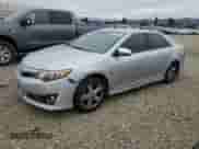 2014 Toyota Camry SE с VIN 4T1BF1FK0EU408886, выставлен на аукционе Copart как лот 80223485 с пробегом 216 997 миль миль и Списание • Salvage title. История ставок и продаж доступна на DreamBid. Изображение 1.