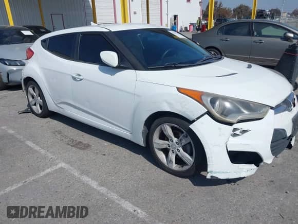 2014 Hyundai Veloster with VIN KMHTC6AD8EU209409, listed as a IAAI auction lot 42087236 with 124,459 mi miles and . Bid and sale history available at DreamBid. Image 1.