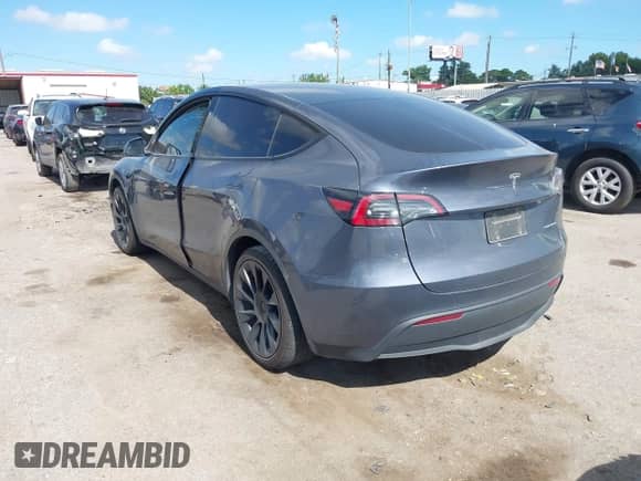 2023 Tesla Model Y Long Range with VIN 7SAYGDEE8PA163534, listed as a IAAI auction lot 42795393 with 45,172 mi miles and . Bid and sale history available at DreamBid. Image 3.