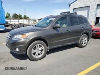 2012 Hyundai Santa Fe Limited с VIN 5XYZK4AG6CG153372, выставлен на аукционе Copart как лот 61257275 с пробегом 157 016 миль миль и Списание • Salvage title. История ставок и продаж доступна на DreamBid. Изображение 1.