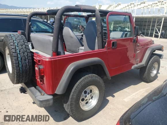 1998 Jeep Wrangler Sport z VIN 1J4FY19S9WP761133, wystawiony jako Copart lot #65012245 z przebiegiem 200 759 mil mil oraz Szkoda całkowita • Salvage title. Historia ofert i sprzedaży dostępna na DreamBid. Obrazek 3.