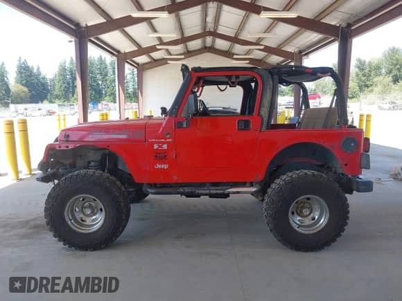 2002 Jeep Wrangler X z VIN 1J4FA39S62P775680, wystawiony jako IAAI lot #42808299 z przebiegiem 118 886 mil mil oraz . Historia ofert i sprzedaży dostępna na DreamBid. Obrazek 14.