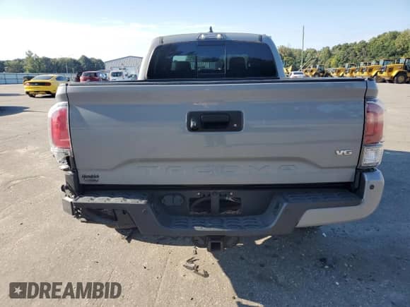 2021 Toyota Tacoma SR5 с VIN 5TFDZ5BN4MX056775, выставлен на аукционе Copart как лот 70674325 с пробегом 55 403 миль миль и Списание • Salvage title. История ставок и продаж доступна на DreamBid. Изображение 6.