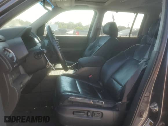 2014 Honda Pilot Touring with VIN 5FNYF3H93EB027479, listed as a Copart auction lot 71527965 with 195,840 mi miles and Salvage title. Bid and sale history available at DreamBid. Image 7.