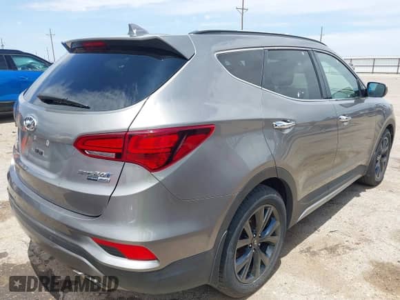 2018 Hyundai Santa Fe Ultimate with VIN 5XYZWDLAXJG531204, listed as a IAAI auction lot 42473418 with 90,726 mi miles and . Bid and sale history available at DreamBid. Image 4.