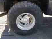 1999 Chevrolet Tahoe z VIN 3GNEK18R7XG189820, wystawiony jako IAAI lot #41631906 z przebiegiem 212 720 mil mil oraz . Historia ofert i sprzedaży dostępna na DreamBid. Obrazek 12.