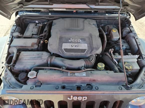 2014 Jeep Wrangler Sport with VIN 1C4AJWAG3EL183304, listed as a Copart auction lot 82155495 with 134,298 mi miles and Salvage title. Bid and sale history available at DreamBid. Image 12.