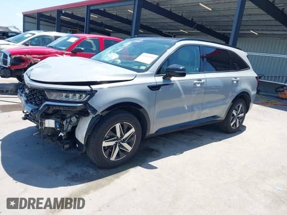 2023 Kia Sorento EX with VIN 5XYRH4LF5PG228054, listed as a IAAI auction lot 42641510 with 16,596 mi miles and . Bid and sale history available at DreamBid. Image 2.