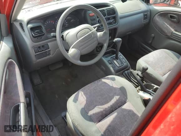1999 Chevrolet Tracker с VIN 2CNBJ18C4X6915828, выставлен на аукционе Copart как лот 62649625 с пробегом 142 216 миль миль и Списание • Salvage title. История ставок и продаж доступна на DreamBid. Изображение 8.