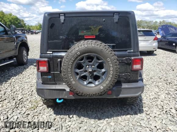 2023 Jeep Wrangler with VIN 1C4JJXN67PW703819, listed as a Copart auction lot 69967635 with 73,238 mi miles and Salvage title. Bid and sale history available at DreamBid. Image 6.