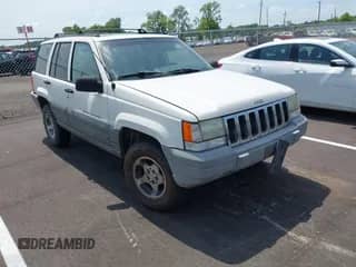 1998 Jeep Grand Cherokee Laredo z VIN 1J4FX58S7WC117455, wystawiony jako IAAI lot #42812555 z przebiegiem 258 604 mil mil oraz . Historia ofert i sprzedaży dostępna na DreamBid. Obrazek 1.