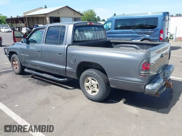 2002 Dodge Dakota Sport with VIN 1B7HL38X42S661356, listed as a IAAI auction lot 42451112 with Not provided miles and . Bid and sale history available at DreamBid. Image 3.