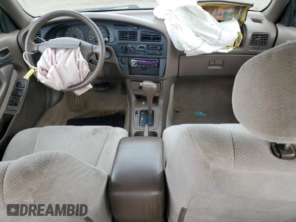 1996 Toyota Camry DX z VIN 4T1BG12K9TU916564, wystawiony jako Copart lot #81695785 z przebiegiem 284 618 mil mil oraz Szkoda całkowita • Salvage title. Historia ofert i sprzedaży dostępna na DreamBid. Obrazek 8.