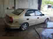 2002 Hyundai Accent GL z VIN KMHCG45C32U373009, wystawiony jako Copart lot #62753865 z przebiegiem Nie podano mil oraz Szkoda całkowita • Salvage title. Historia ofert i sprzedaży dostępna na DreamBid. Obrazek 3.