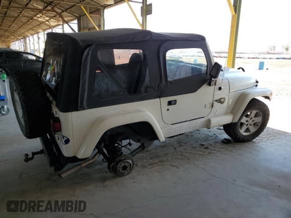 1997 Jeep Wrangler Sahara with VIN 1J4FY49S6VP523577, listed as a Copart auction lot 66736805 with 194,481 mi miles and Salvage title. Bid and sale history available at DreamBid. Image 3.