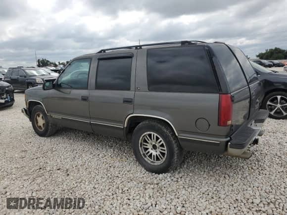 1999 Chevrolet Tahoe Police Special z VIN 1GNEC13R6XR150124, wystawiony jako Copart lot #70630524 z przebiegiem 238 990 mil mil oraz Szkoda całkowita • Salvage title. Historia ofert i sprzedaży dostępna na DreamBid. Obrazek 2.
