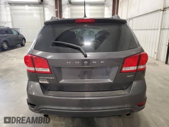 2017 Dodge Journey SXT with VIN 3C4PDDBG1HT703237, listed as a Copart auction lot 71018395 with 82,536 mi miles and Salvage title. Bid and sale history available at DreamBid. Image 6.