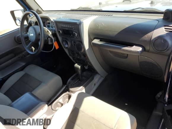 2010 Jeep Wrangler Sport z VIN 1J4AA2D12AL119064, wystawiony jako Copart lot #53026765 z przebiegiem 97 403 mil mil oraz Szkoda całkowita • Salvage title. Historia ofert i sprzedaży dostępna na DreamBid. Obrazek 8.