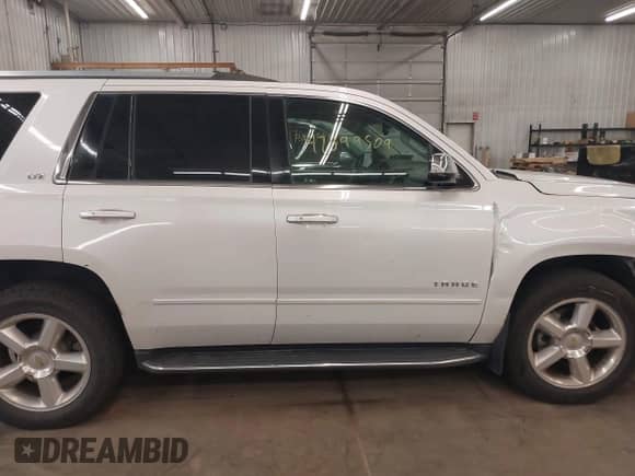 2016 Chevrolet Tahoe LTZ with VIN 1GNSKCKC8GR273955, listed as a IAAI auction lot 42899509 with 163,672 mi miles and . Bid and sale history available at DreamBid. Image 14.