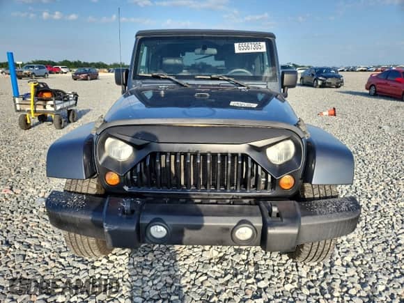 2007 Jeep Wrangler Sahara z VIN 1J4FA54137L136200, wystawiony jako Copart lot #65567305 z przebiegiem 175 178 mil mil oraz Czysty tytuł • Clean title. Historia ofert i sprzedaży dostępna na DreamBid. Obrazek 5.