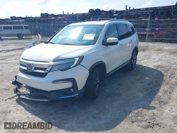 2019 Honda Pilot Touring 8-Passenger z VIN 5FNYF5H9XKB001842, wystawiony jako IAAI lot #43026784 z przebiegiem 114 674 mil mil oraz . Historia ofert i sprzedaży dostępna na DreamBid. Obrazek 2.