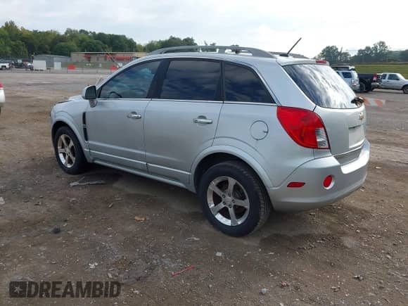 2013 Chevrolet Captiva Sport LT z VIN 3GNAL3EK5DS625250, wystawiony jako IAAI lot #43284620 z przebiegiem 123 334 mil mil oraz . Historia ofert i sprzedaży dostępna na DreamBid. Obrazek 3.