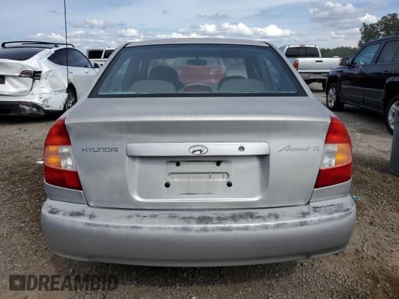 2002 Hyundai Accent GL z VIN KMHCG45C12U398748, wystawiony jako Copart lot #82077055 z przebiegiem 175 456 mil mil oraz Czysty tytuł • Clean title. Historia ofert i sprzedaży dostępna na DreamBid. Obrazek 6.