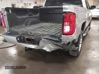 2018 Chevrolet Silverado 1500 LT with VIN 3GCUKRECXJG492648, listed as a IAAI auction lot 42419524 with 124,277 mi miles and . Bid and sale history available at DreamBid. Image 6.