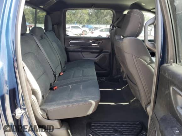 2023 Ram 1500 Big Horn with VIN 1C6SRFMT7PN556509, listed as a Copart auction lot 42938185 with 18,049 mi miles and Salvage title. Bid and sale history available at DreamBid. Image 10.