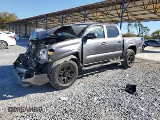 2021 Toyota Tacoma SR with VIN 5TFCZ5AN9MX274126, listed as a Copart auction lot 87295075 with 63,596 mi miles and Salvage title. Bid and sale history available at DreamBid. Image 1.