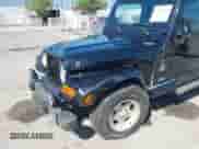 2001 Jeep Wrangler Sahara with VIN 1J4FA59S41P313113, listed as a IAAI auction lot 42266173 with 125,792 mi miles and . Bid and sale history available at DreamBid. Image 6.