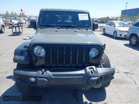 2021 Jeep Wrangler Unlimited 80th Anniversary with VIN 1C4HJXDG0MW692859, listed as a IAAI auction lot 43138758 with 58,354 mi miles and . Bid and sale history available at DreamBid. Image 13.