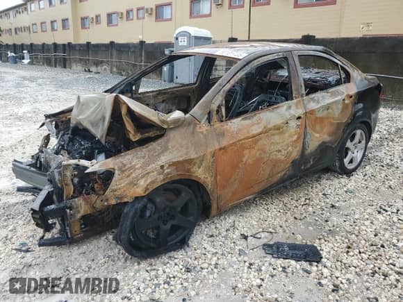 2013 Chevrolet Sonic LTZ с VIN 1G1JE5SHXD4169990, выставлен на аукционе Copart как лот 80101435 с пробегом Не указан миль и На запчасти • Non repairable. История ставок и продаж доступна на DreamBid. Изображение 1.