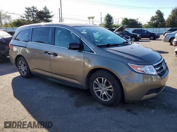 2011 Honda Odyssey LX with VIN 5FNRL5H28BB021474, listed as a Copart auction lot 82377315 with 226,433 mi miles and Salvage title. Bid and sale history available at DreamBid. Image 4.