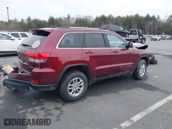 2019 Jeep Grand Cherokee Laredo E with VIN 1C4RJFAG2KC814154, listed as a IAAI auction lot 38877814 with 54,119 mi miles and . Bid and sale history available at DreamBid. Image 4.