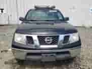 2010 Nissan Frontier SE with VIN 1N6AD0CWXAC402288, listed as a Copart auction lot 68748555 with 238,383 mi miles and Salvage title. Bid and sale history available at DreamBid. Image 5.