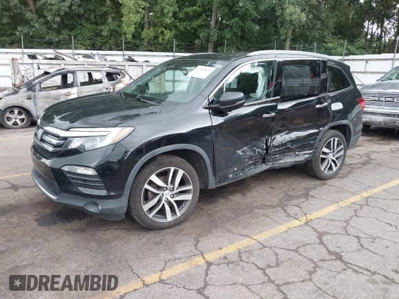 2017 Honda Pilot Touring z VIN 5FNYF6H96HB055928, wystawiony jako IAAI lot #42955822 z przebiegiem 97 085 mil mil oraz . Historia ofert i sprzedaży dostępna na DreamBid. Obrazek 2.