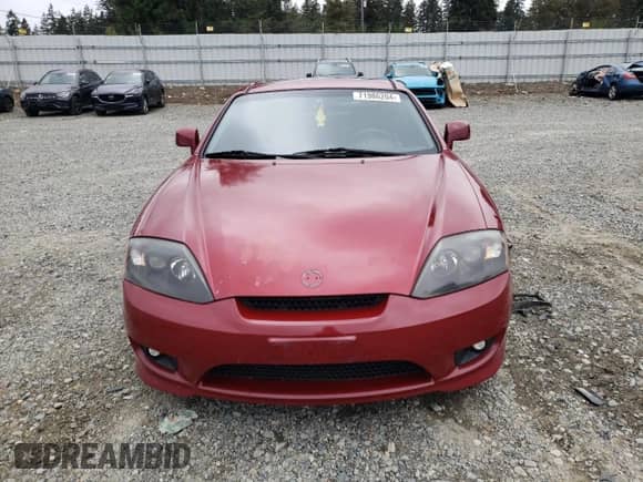 2006 Hyundai Tiburon GT с VIN KMHHN65FX6U228735, выставлен на аукционе Copart как лот 71986204 с пробегом 179 943 миль миль и Списание • Salvage title. История ставок и продаж доступна на DreamBid. Изображение 5.