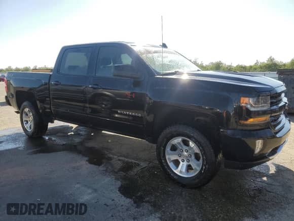 2018 Chevrolet Silverado 1500 LT z VIN 3GCUKREC3JG516403, wystawiony jako Copart lot #82135815 z przebiegiem 138 927 mil mil oraz Szkoda całkowita • Salvage title. Historia ofert i sprzedaży dostępna na DreamBid. Obrazek 4.