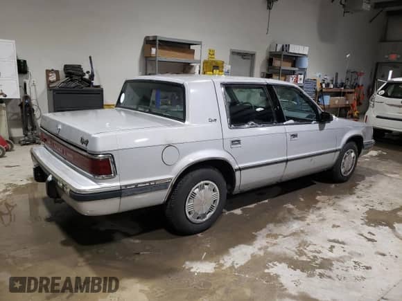 1989 Dodge Dynasty with VIN 1B3BC4634KD442902, listed as a Copart auction lot 85151394 with 63,120 mi miles and Clean title. Bid and sale history available at DreamBid. Image 3.